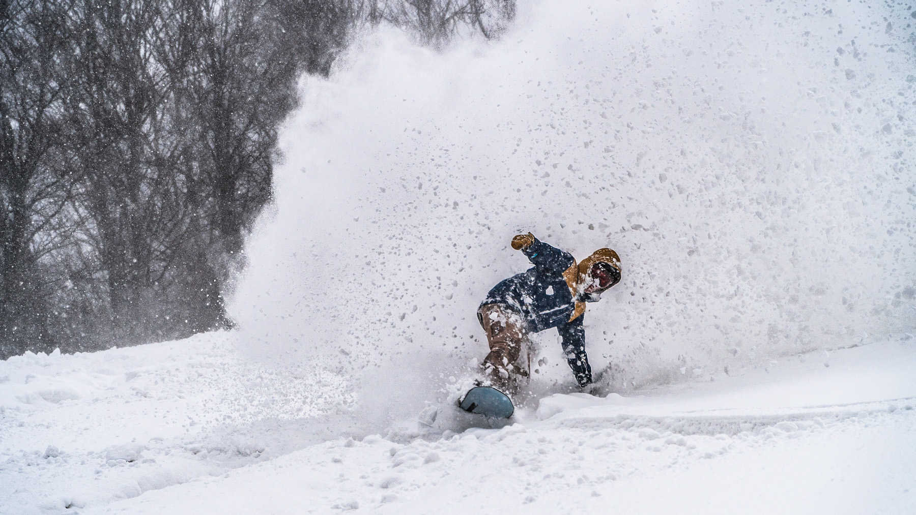 snowboarding in deep powder madarao